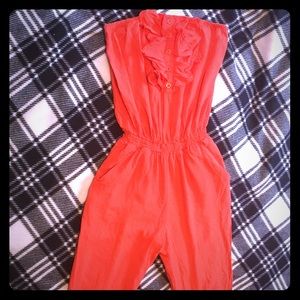 Orange strapless jump suit with ruffles